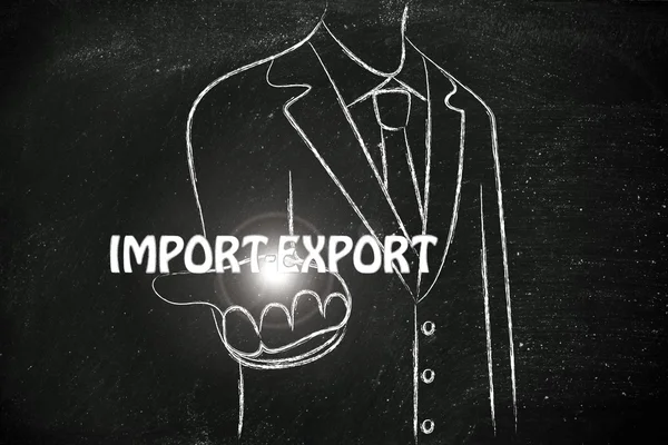 Hombre de negocios que sostiene la palabra Import-Export — Foto de Stock