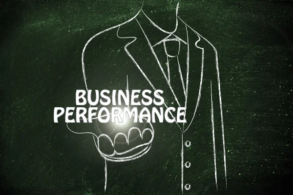 Business man handing out the word Business Performance — Stock Photo, Image