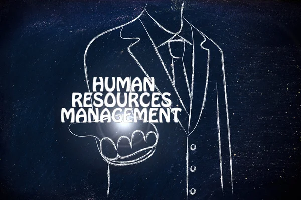 人的資源管理という言葉を配ってビジネス男性 — ストック写真