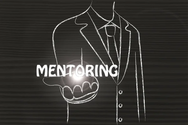 Business man handing out the word Mentoring — Stock Photo, Image