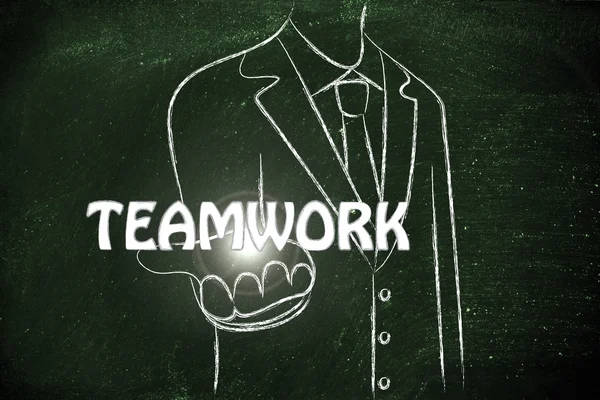 Geschäftsmann verteilt das Wort Teamwork — Stockfoto