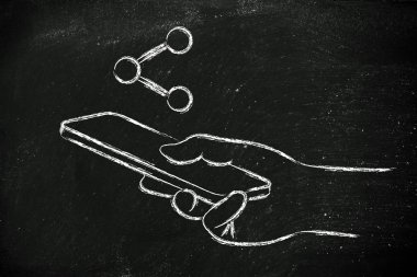 El ele tutuşan cep telefonu