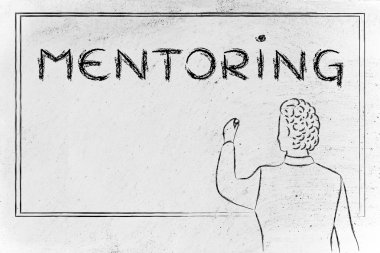 teacher writing on blakboard about mentoring