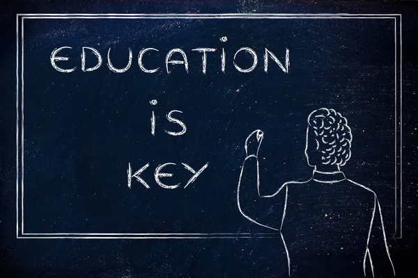 Teacher writing on blakboard: education is key — Stock Photo, Image