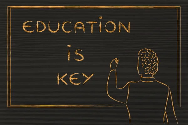 Teacher writing on blakboard: education is key — Stock fotografie