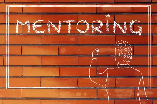 Teacher writing on blakboard about mentoring — Stockfoto