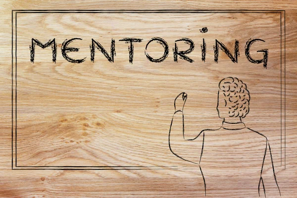 Teacher writing on blakboard about mentoring — ストック写真