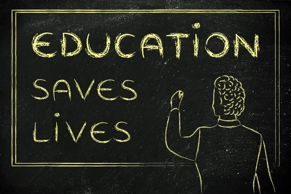 Teacher writing on blakboard: education saves lives — Zdjęcie stockowe