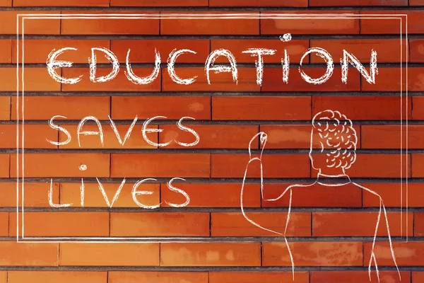 Teacher writing on blakboard: education saves lives — Stok fotoğraf
