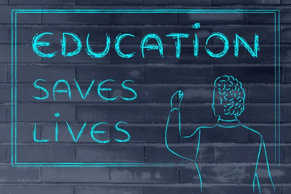 Teacher writing on blakboard: education saves lives — ストック写真