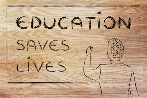 Teacher writing on blakboard: education saves lives — ストック写真