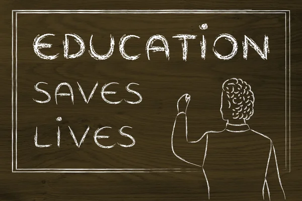 Teacher writing on blakboard: education saves lives — Zdjęcie stockowe