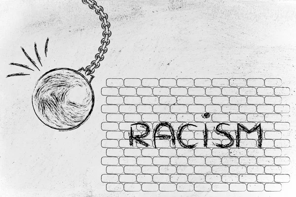 Bola destruindo contra a palavra racismo — Fotografia de Stock