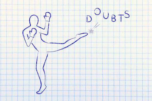 Person kicking and boxing the word doubts — Stock Photo, Image