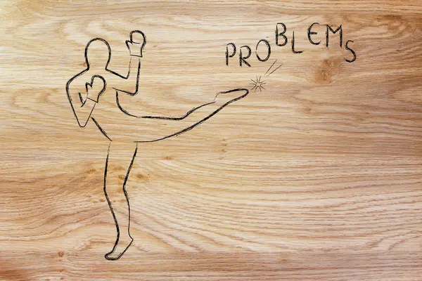 Pessoa chutando e boxe a palavra problemas — Fotografia de Stock