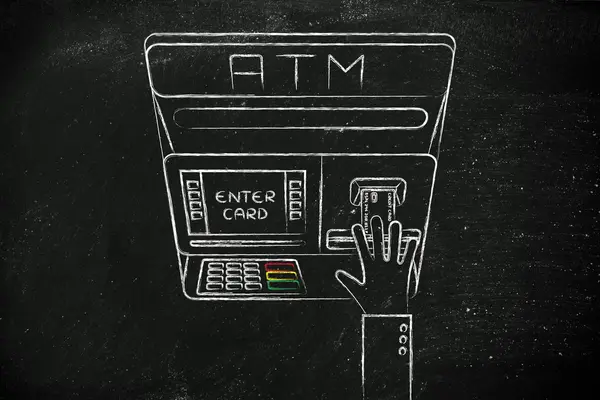 Automatic teller machine with hand inserting credit card — Stock fotografie