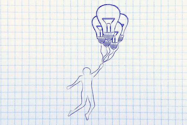 Человек держит до шариков в форме лампочки — стоковое фото