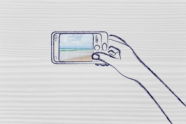 Hand som håller smartphone med beach foto på skärmen — Stockfoto