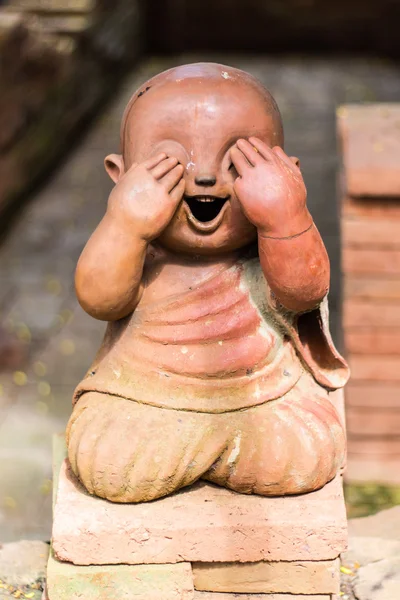 Smiling buddhist novice made of clay, Thai style — Stock Photo, Image