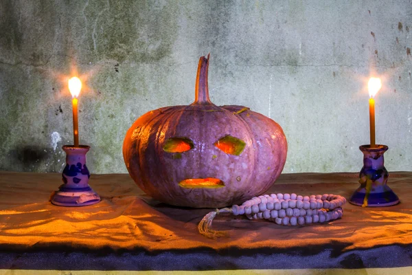 Halloween still life with pumpkins, candles and rosary — Stock Photo, Image