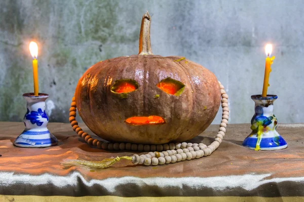 Halloween still life with pumpkins, candles and rosary — Stock Photo, Image