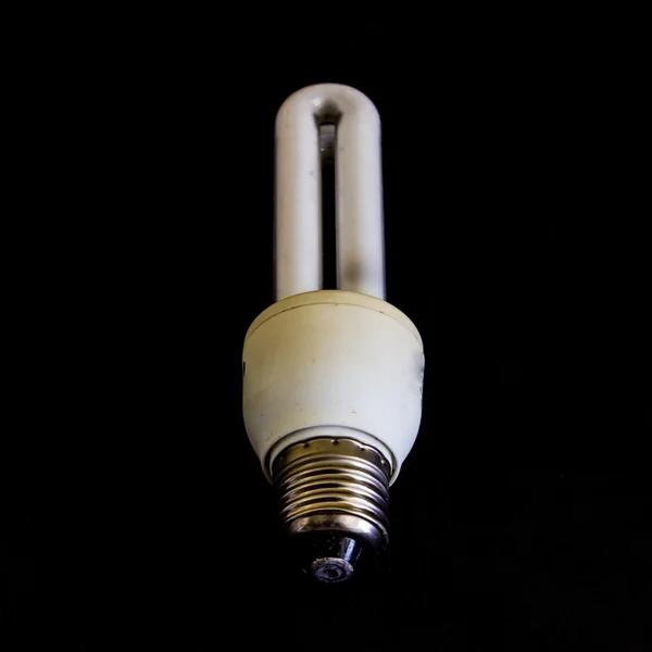 Fluorescent lamp energy saving on black — Stock Photo, Image