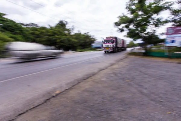 Truck panning camera in road — Stock Photo, Image