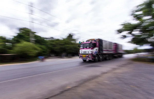 Truck panning camera in road — Stock Photo, Image