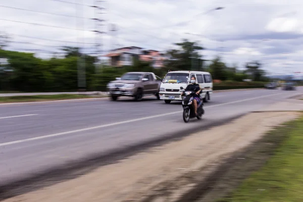 Motorcycle and cars panning in road, Asia — Stock Photo, Image