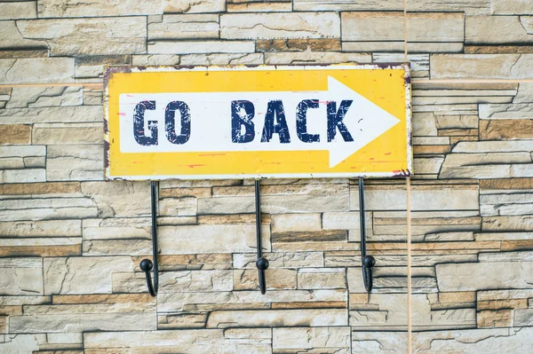 Go back sign on the wall — 스톡 사진