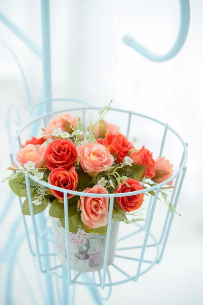 Artificial roses in the basket — Stock Photo, Image