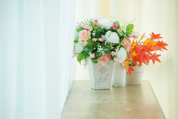 Artificial roses in the basket — Stock Photo, Image