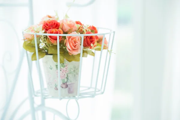 Artificial roses in the basket — Stock Photo, Image