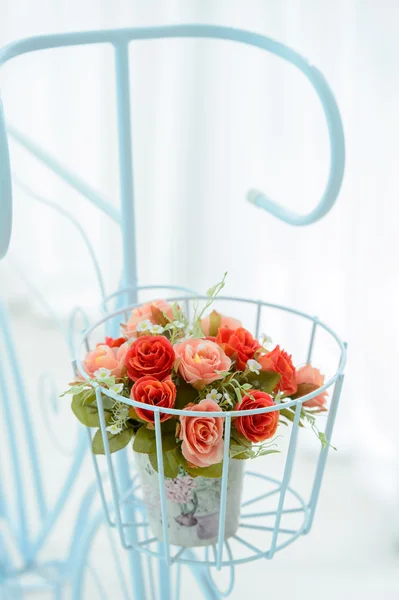 Artificial roses in the basket — Stock Photo, Image