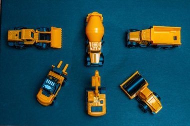 Six kind of Construction Vehicles models on black background.