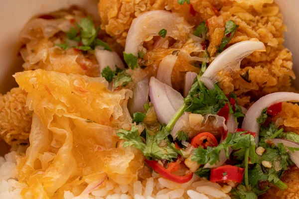 Delicious fried chicken with white rice or stream rice in the bucket.