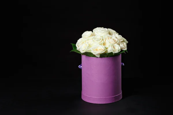 White roses in a small gift box purple round space for the logo, — Stock Photo, Image