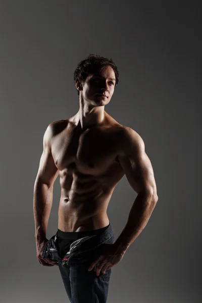 Muscular male model bodybuilder before training. Studio shot on — Stock Photo, Image