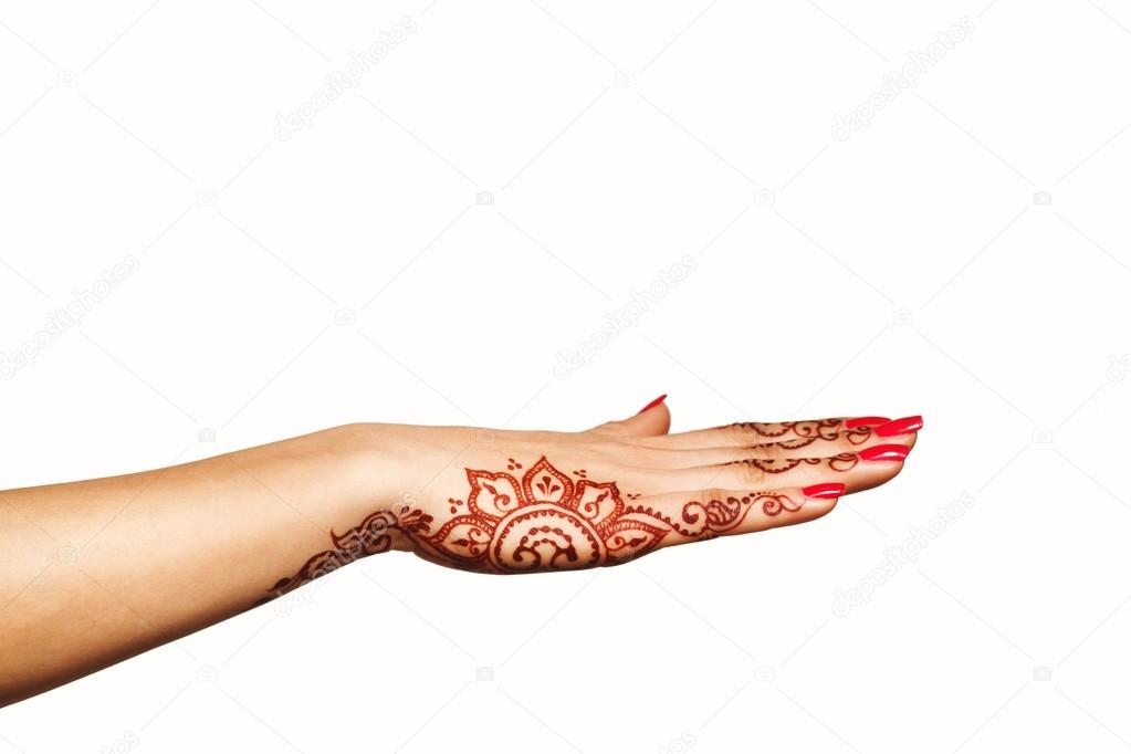 wrist and hand of young girl with henna mehendi