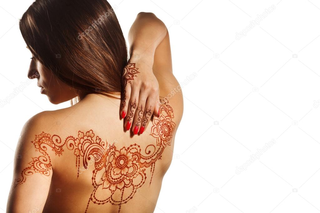 naked back of young girl with henna mehendi