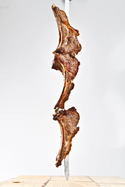 Hot roasted meat shish kebab on metal skewer — Stock Photo, Image