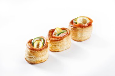 Nice set of canapes for one person with vegetables, cheese, fruits, berries, salami, seafood, meat and decoration on white background studio isolated with space for text template