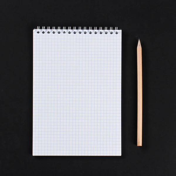 Blank notepad with pencil on office black table. template. — Stock Photo, Image