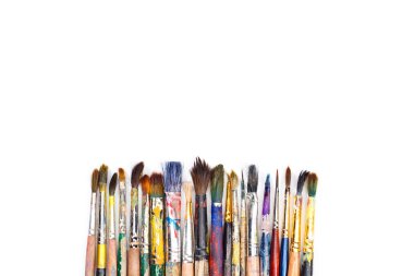 Big set of artist dirty paint brushes on white background with much space for text. Isolated image. clipart
