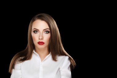 young beautiful brunette woman with makeup and red lips in white shirt on black background