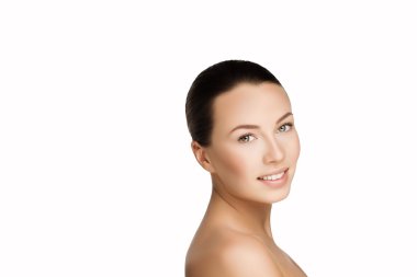 beautiful young smiling brunette woman with clean fresh skin with nude makeup. Closeup real photo