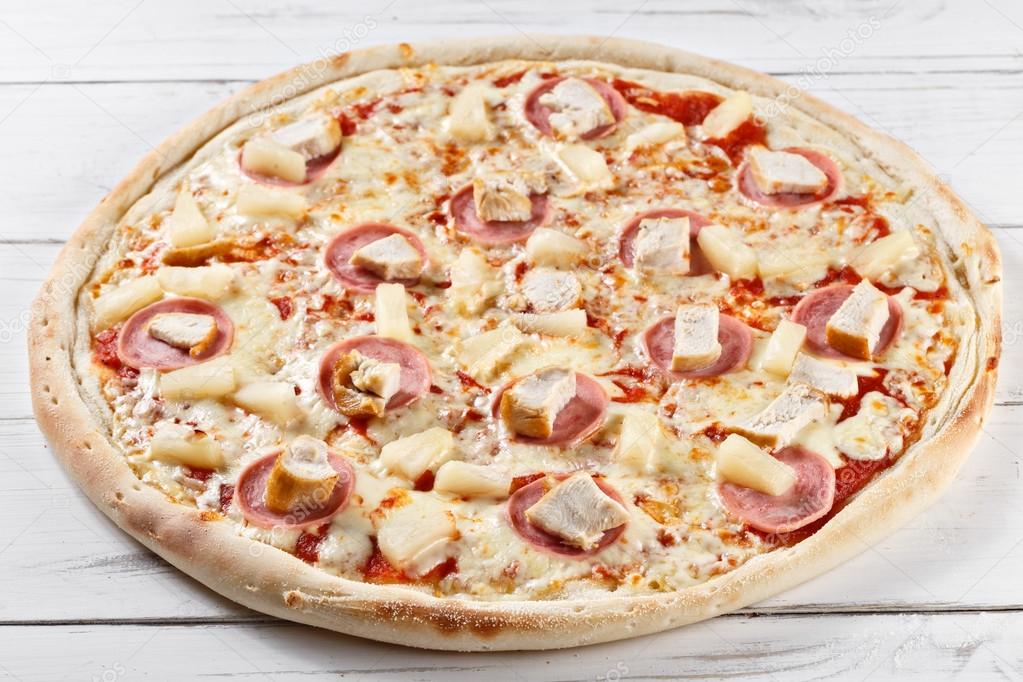 Delicious fresh chikita pizza with chicken and pineapple served 