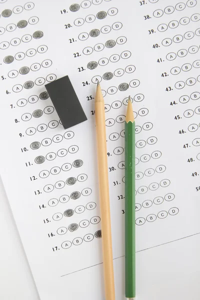 Standardized test form with answers bubbled in and a pencil, foc — Stock Photo, Image