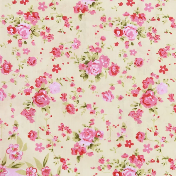 Rosa tyg bakgrund, fragment av färgglada retro väv text — Stockfoto