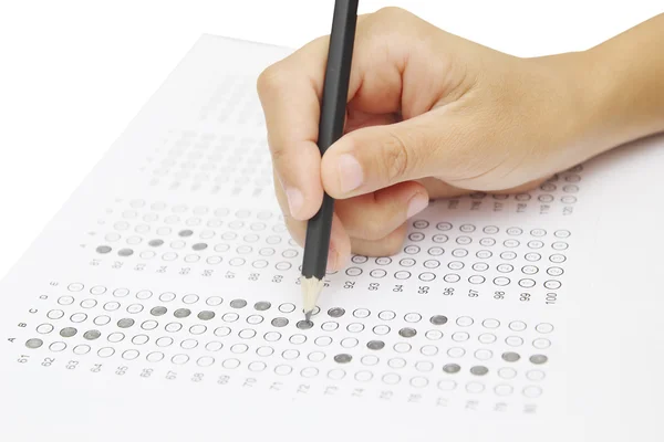 Standardized test form with answers bubbled in and a pencil, foc — Stock Photo, Image